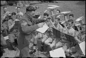 Tenor horn and base sections of 6 NZ Infantry Brigade Band playing under conductorship of Staff Sergeant F Sykes, Italy, World War II - Photograph taken by George Bull