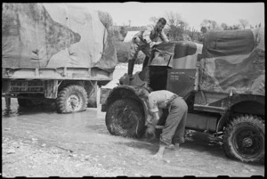 R F Skews and J Ball wash their trucks in the Volturno River, Italy, World War II - Photograph taken by George Bull