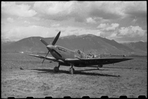 Flying Officer L J Montgomery in his Spitfire aeroplane in the Volturno Valley, Italy, World War II - Photograph taken by George Bull