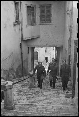 C Mentiplay, W Robins and D S Saunders climb cobbled streets of old Campobasso, Italy, World War II - Photograph taken by George Bull