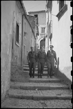 New Zealanders on leave from the front line walk down narrow cobbled streets of old Campobasso, Italy, World War II - Photograph taken by George Bull