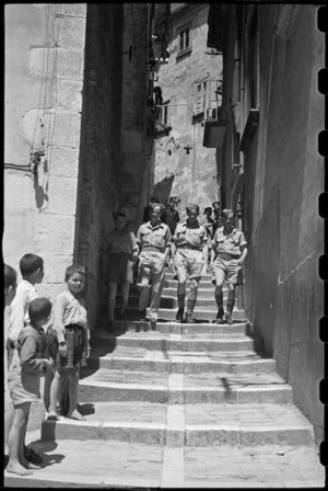 New Zealanders seen in one of the narrow and steep streets of Campobasso, Italy, during World War II - Photograph taken by George Bull