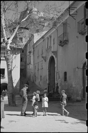 New Zealand soldier on leave in Campobasso attracts local children, Italy, World War II - Photograph taken by George Bull