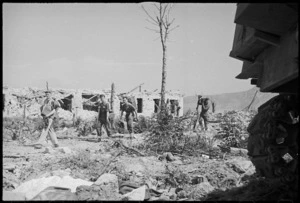 Infantrymen among the ruins of Cassino on the day it fell to the attack of 8th Army, Italy, World War II - Photograph taken by George Kaye