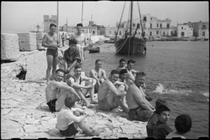 Patients at 1 NZ Convalescent Depot swimming off the breakwater at Santo Spirito, Italy, World War II - Photograph taken by George Bull
