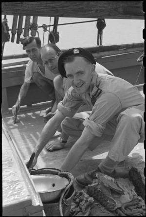 New Zealanders painting decks of Yugoslav cutter for use by 1 NZ Convalescent Depot patients, Santo Spirito, Italy, World War II - Photograph taken by George Bull