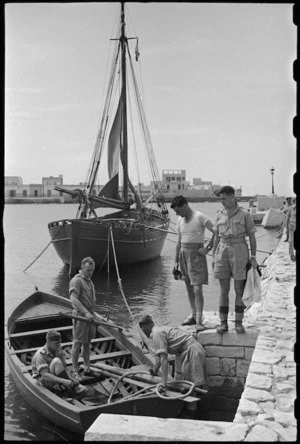 New Zealanders at 1 NZ Convalescent Depot launch rowing boat at Santo Spirito, Italy, World War II - Photograph taken by George Bull