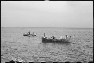 New Zealanders from 1 NZ Convalescent Depot fishing from boat off Santo Spirito, Italy, World War II - Photograph taken by George Bull