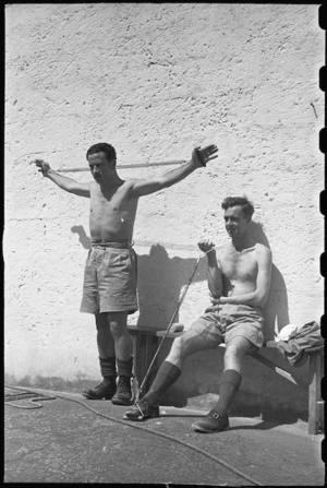 M Wineere and S M Toms using springs for remedial exercises at 1 NZ Convalescent Depot at Santo Spirito, Italy, World War II - Photograph taken by George Bull