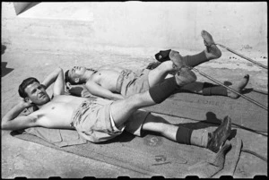 F J G Waller and A E Latimer doing remedial leg exercises at 1 NZ Convalescent Depot at Santo Spirito, Italy, World War II - Photograph taken by George Bull