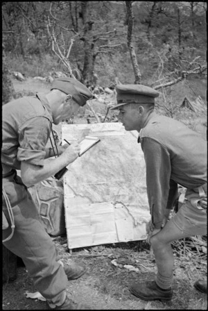 2nd Lieutenant J Gardiner gives machine gun platoon commander Lieutenant J R Johnson information about main 5th Army Front, Italy, World War II - Photograph taken by George Kaye