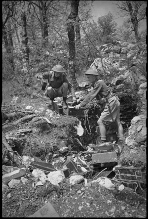 K A Jacobs and R W North collecting ammunition from a pit on 8th Army Front, Italy, World War II - Photograph taken by George Kaye