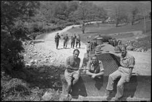 NZ Engineers with bulldozer on a road they helped build in hilly country on the Cassino Front, Italy, World War II - Photograph taken by George Kaye
