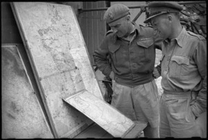 Brigadier Cyril Weir and Major J M D McCredie study a map of the Italian Front, World War II - Photograph taken by George Kaye