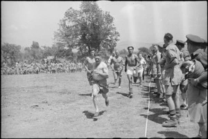 First lap of the 880 yards race 5 NZ Infantry Brigade Sports Meeting in Italy, World War II - Photograph taken by George Kaye