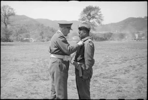 Major A Awatere receives the Military Cross from General Freyberg at 5 NZ Infantry Brigade parade in the Volturno Valley, Italy, World War II - Photograph taken by George Kaye