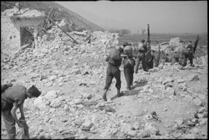 Allied infantrymen moving over the ruins of Cassino on the day it fell to the Allied attack, Italy, World War II - Photograph taken by George Kaye