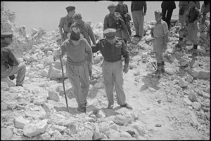 Prime Minister Peter Fraser and General Bernard Freyberg in conversation in ruins of Abbey Cassino, Italy, World War II - Photograph taken by George Kaye