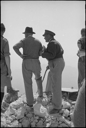 Prime Minister Peter Fraser and General Bernard Freyberg look down on ruins of Cassino, Italy, World War II - Photograph taken by George Kaye