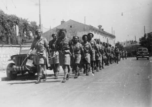 Soldiers of the Maori Battalion marching to keep fit, near Trieste, Italy
