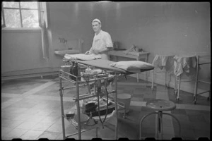 O A Bennett preparing operating theatre at 1 New Zealand General Hospital, Molfetta, Italy, World War II - Photograph taken by George Bull