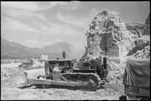 Bulldozers clear debris near ruins of Cassino Cathedral, Italy, World War II - Photograph taken by George Kaye
