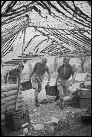 Gunners of NZ Divisional Artillery bring ammunition to gun pit in the Cassino area, Italy, World War II - Photograph taken by George Kaye