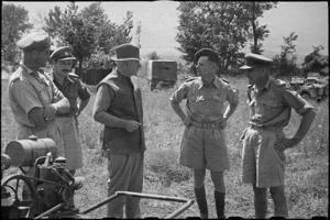 Prime Minister Peter Fraser and Colonel R D King with officers of a NZ Field Hygiene Section near St Elia, Italy - Photograph taken by George Bull