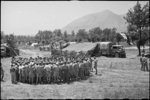 General view of Prime Minister Peter Fraser talking to personnel of 4 NZ Field Ambulance near Casino, Italy, World War II - Photograph taken by George Bull