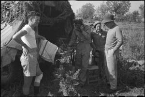 Prime Minister Peter Fraser meeting personnel of 19 NZ Armoured Regiment at St Elia, Italy, World War II - Photograph taken by George Bull