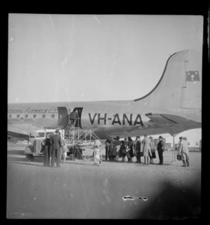 Passengers embarking passenger aircraft Douglas DC-4 Skymaster Amana, ANA (Australian National Airways), tail number VH-ANA