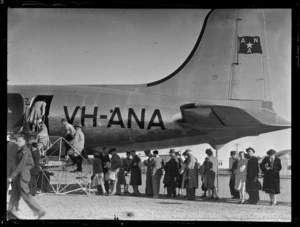 Passengers embarking passenger aircraft Douglas DC-4 Skymaster Amana, ANA (Australian National Airways), tail number VH-ANA