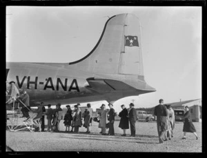 Passengers embarking passenger aircraft Douglas DC-4 Skymaster Amana, ANA (Australian National Airways), tail number VH-ANA