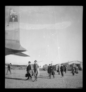 Passengers embarking passenger aircraft Douglas DC-4 Skymaster Amana, ANA (Australian National Airways), tail number VH-ANA