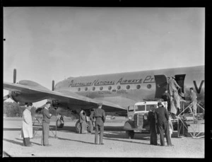 Passengers boarding aircraft Douglas DC-4 Skymaster Amana, VH-ANA, operated by ANA (Australian National Airways), at RNZAF Station, Whenuapai, Auckland