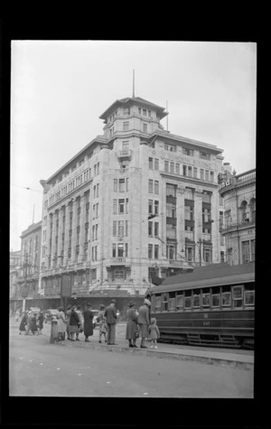Dilworth Building, Customs Street, Auckland, includes tram and pedestrians