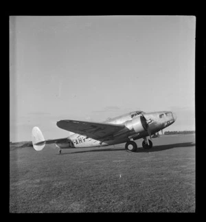 Portrait of a Lockheed Hudson aircraft, ZK-AHY, at Union Airways airfield, Mangere, Auckland