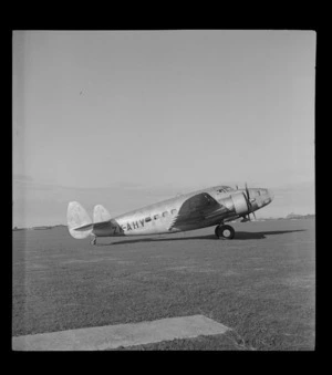 Portrait of a Lockheed Hudson aircraft, ZK-AHY, at Union Airways airfield, Mangere, Auckland