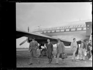 The arrival of PAA's 5th Survey Group with unidentified men disembarking from a PAA passenger plane, Whenuapai Airfield, Auckland