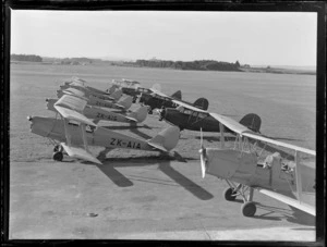 View of a line up of Tiger Moths and Rearwin Beechcraft aeroplanes, Auckland Aero Club, Mangere Airfield, Auckland