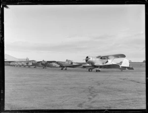 View of a line up of Auckland Aero Club Tiger Moth and Rearwin Beechcraft aeroplanes, Mangere Airfield, Auckland