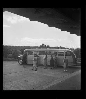 View of passengers boarding Johnston's Airways Transport bus Kiwi 2, Auckland Railway Station