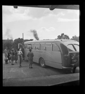 View of passengers boarding Johnston's Airways Transport bus Kiwi 2, Auckland Railway Station