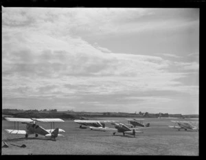 A rear view of a line up of Auckland Aero Club Tiger Moth aeroplanes, Mangere Airfield, Auckland