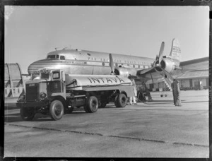 Vacuum Oil 'Intrava' trailer and a Pan American Airways Clipper Mandarin aircraft, Whenuapai airfield, Auckland