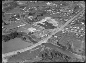 View of Crum Brick, Tile & Pottery Company factory at New Lynn with clay excavation behind, with Great North Road and Portage Road junction in foreground, Auckland City