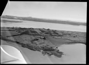 View of the Kellihers' Puketutu Island farm, looking across the Manukau Harbour to New Lyn and Mount Roskill, South Auckland