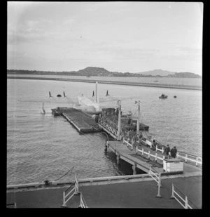 View of the First Sutherland flying boat's arrival of Civil Air Force Services [personnel?] at Mechanics Bay, Auckland City