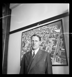 Portrait of John Feuss, American [Consul?] Auckland, at Whites Aviation Office, Auckland