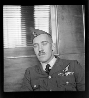 Portrait of Flight Lieutenant Ivan R Mitchell in uniform of the 41st Squadron RNZAF, Whites Aviation Office, Auckland